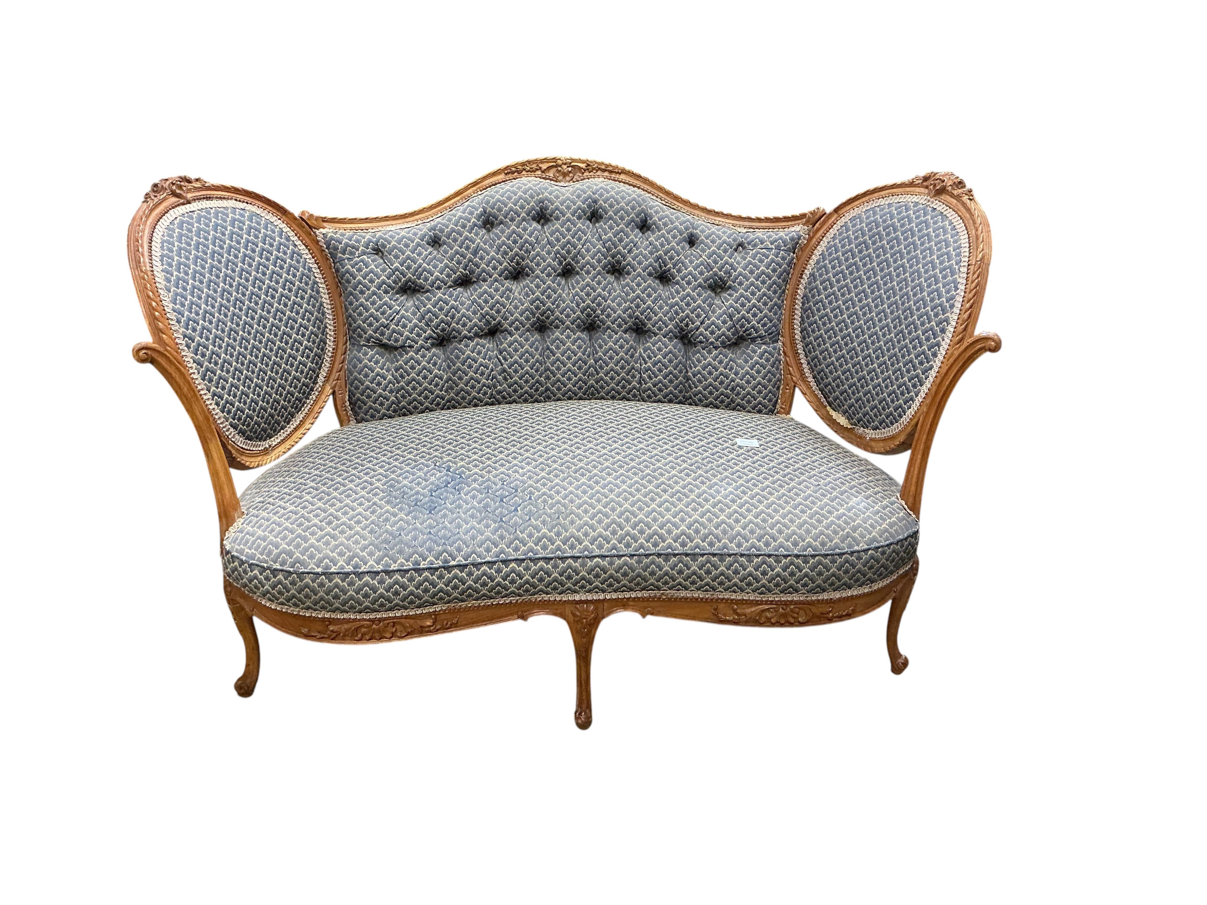 A late 19th / early 20th century French upholstered carved walnut upholstered settee, width 136cm, depth 68cm, height 86cm
